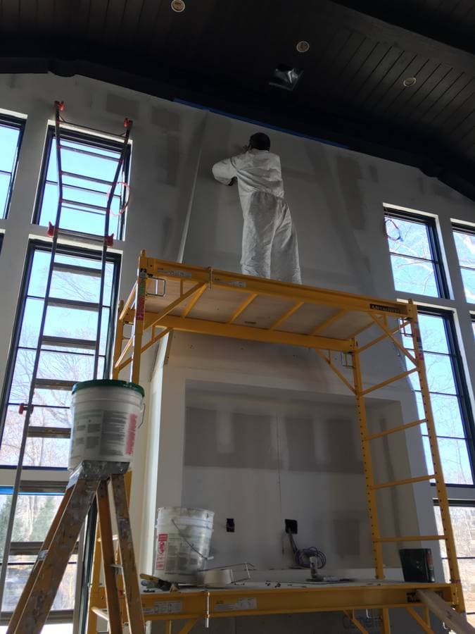 picture of a commercial building in new york long island island park getting its drywall prepped ready to be painted